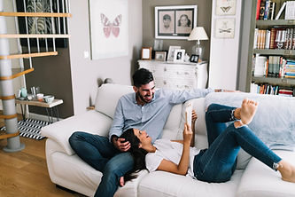 A couple enjoying their new radiant floor installation from DAflure heating cooling and solar