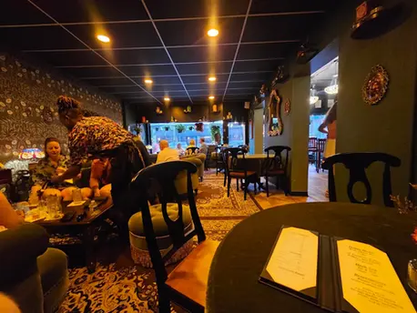Inside Madame Rochéle's Apothecary, a high-end cocktail bar in Harrisburg, PA with botanical apothecary vibes