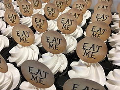Cupcakes for an Alice in Wonderland Themed Bridal Shower with the Words Eat Me out of the top