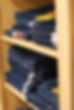 Dark denim jeans in shelves at Back to Basics Western Wear in their Dillsburg PA showroom