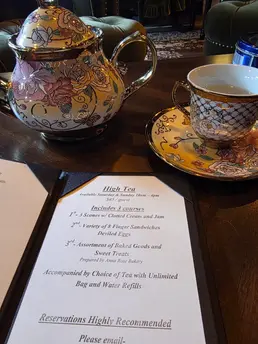 Teapot, teacup, and a menu at Madame Rochele's Apothecary, the newest bar in downtown Harrisburg, PA