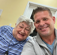 Rob Neidlinger, owner of Silver Spring Personal Care Home, with a resident