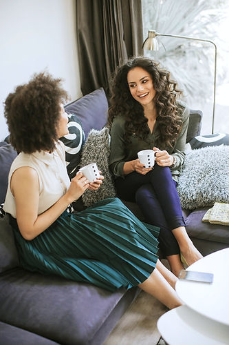 Sisters at home in their Hummelstown home enjoying coffee after their HVAC furnace replacement by Daflure Heating Cooling and Solar
