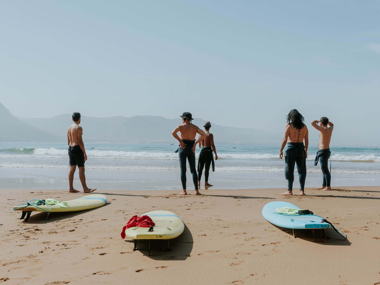 surfers looking out to the waves