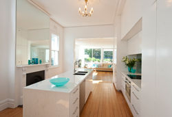 Fairlight 1 Fireplace and island in kitchen.jpg