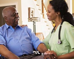 A Nurse helping a Resident