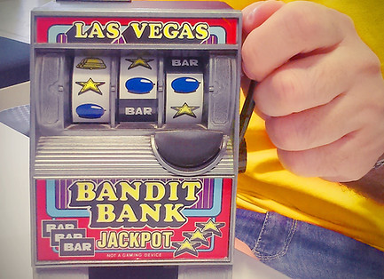 Toy slot machine being held by man