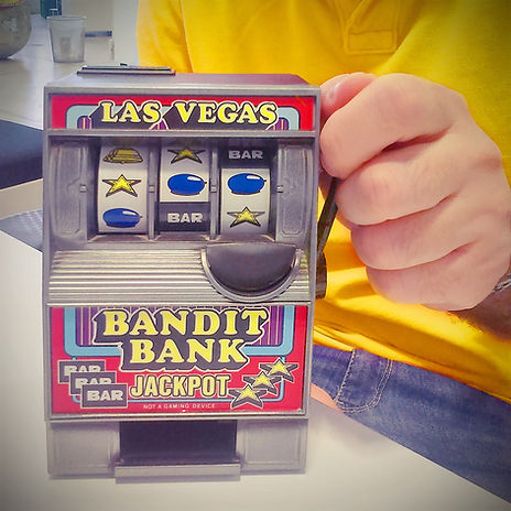 Toy slot machine being held by man
