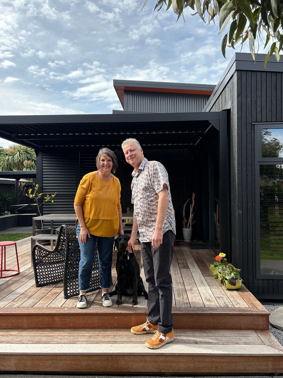 Tracey and Marc Coulthard at their Amberley Beach home with dog Astro. Marc chairs the Amberley Beach Residents and Ratepayers Association, which has submitted against Plan Change 7. Photo Claire Inkson