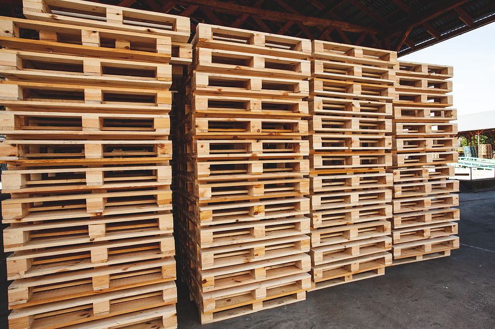 wooden-pallets-stacked-top-each-other-several-rows-warehouse.jpg