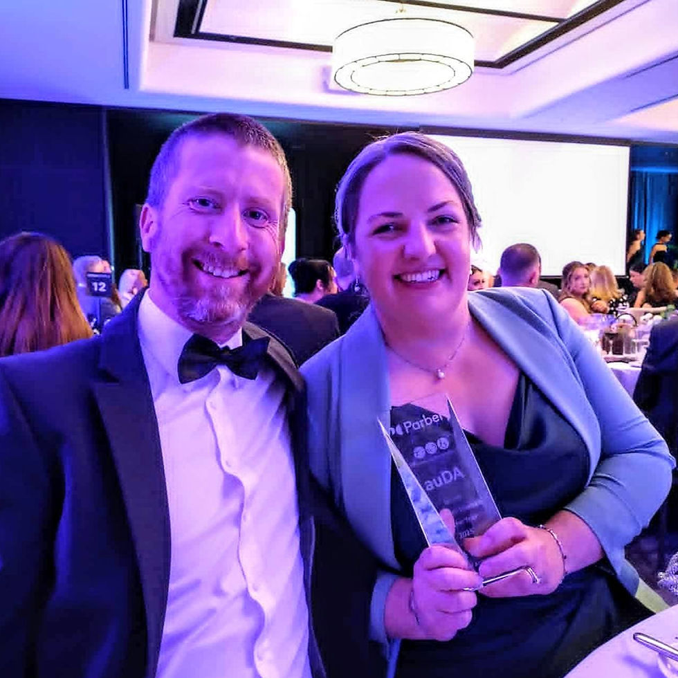 Paul and Reine Williams holding the Canberra Micro Business Woman of the year 2025 trophy at the awards gala night.