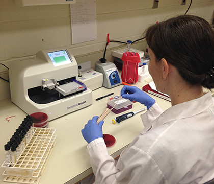 Mary testing the susceptibility of her organisms using the Sensititre system.