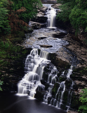 New Lanark falls of clyde waterfall long exposure smooth water summer water
