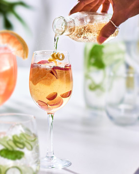 JP Chenet Wine cocktail on a sunlit white garden table. Personal Work, © Michele Jorsling Drinks Photography.