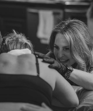 Birth doula providing emotional and physical support during labor in East Texas