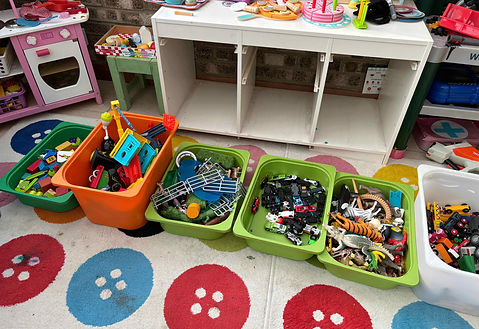 A playroom being decluttered.