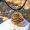 Thumbnail: Garnet & Copper + Gold Orgonite Pocket Protection Pyramid/Wire Cage Pendant