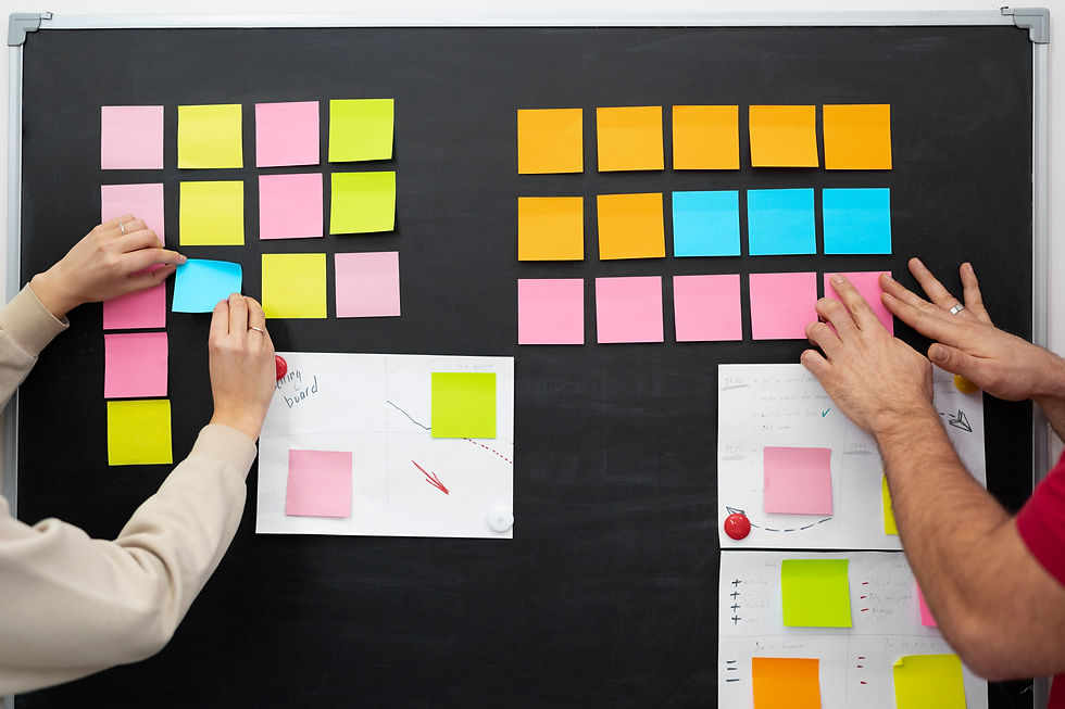 colleagues-sticking-colorful-post-its-together.jpg