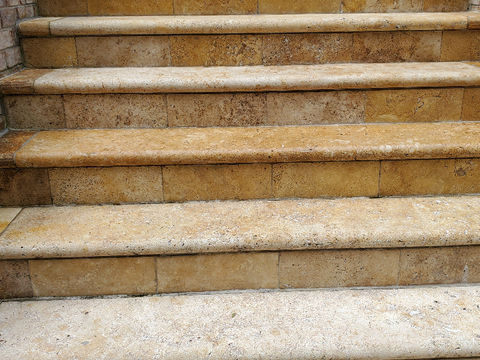 Clean stone steps leading up to a house