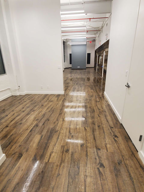 Gleaming hardwood floors in a clean office hallway