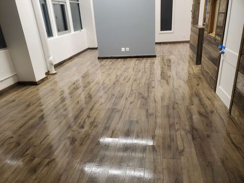 Shiny hardwood floors gleam after professional cleaning