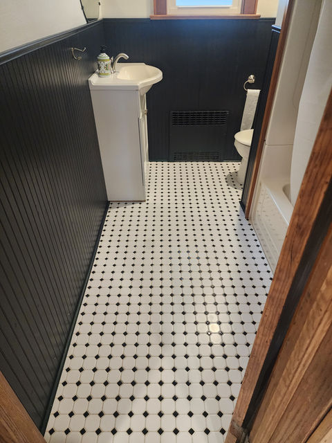 Clean black and white bathroom floor tiles