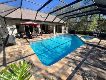 Screened-in custom pool designs Homosassa FL with patio.