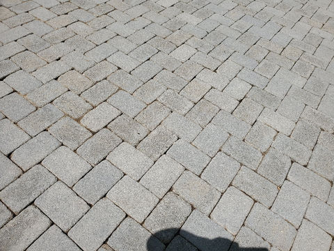 Grey granite paving stones, herringbone pattern