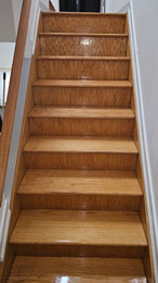 Clean, shiny hardwood staircase