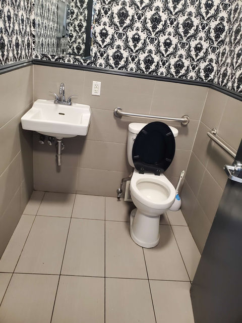 Clean restroom with sink and toilet