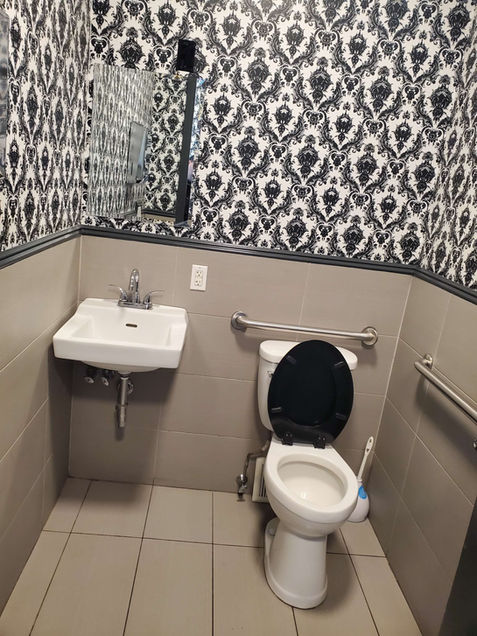 Clean restroom with sink and toilet