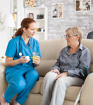 female-doctor-talking-with-senior-woman-nursing-home-about-new-drug-pills.jpg
