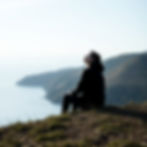 Person practicing Radical Acceptance through mindfulness and self-reflection to improve emotional well-being.