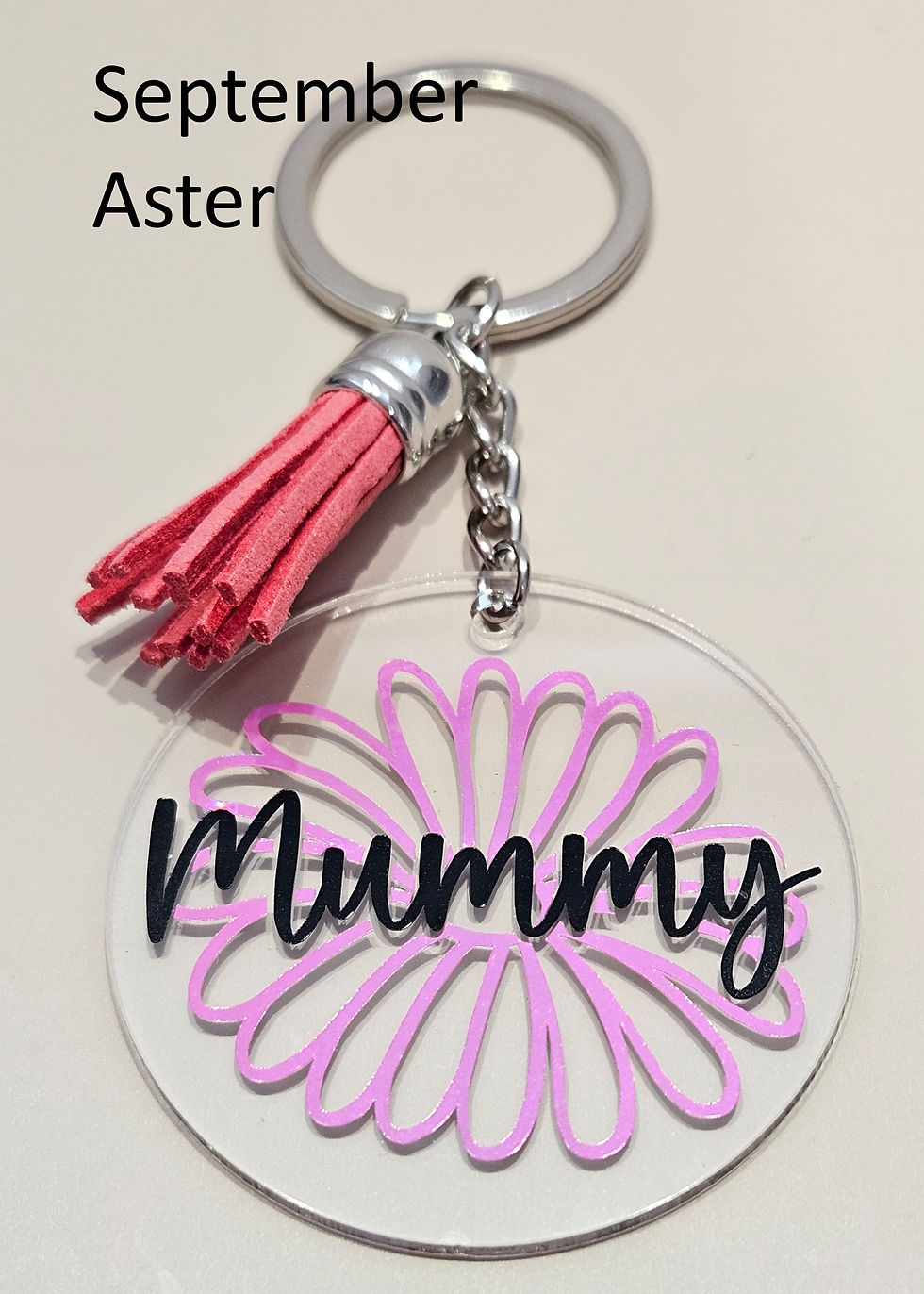 Thumbnail: pink birth flower keychain for september with name mummy in black