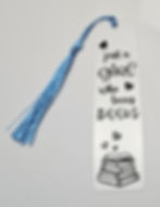 pile of books decal with words just a girl who loves books on clear acrylic bookmark with blue tassel