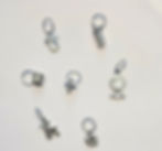 7 silver coloured charms for knitting or crochet. 1 baby vest, 1 baby bottle, 1 baby cup, 1 dummy/pacifier, 1 baby, 1 pram an