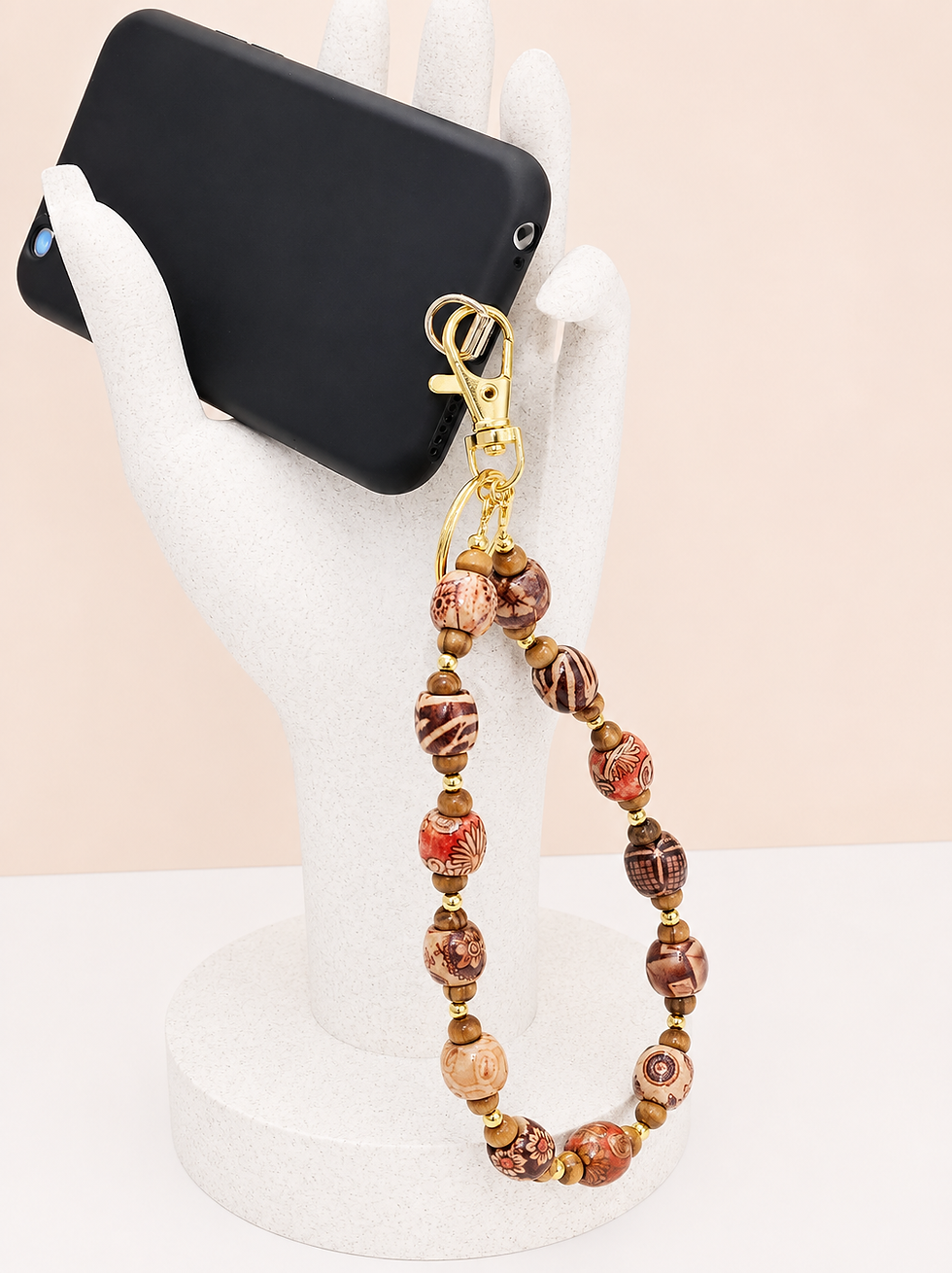 Thumbnail: wood bead wristlet mobile phone tether displayed in hand