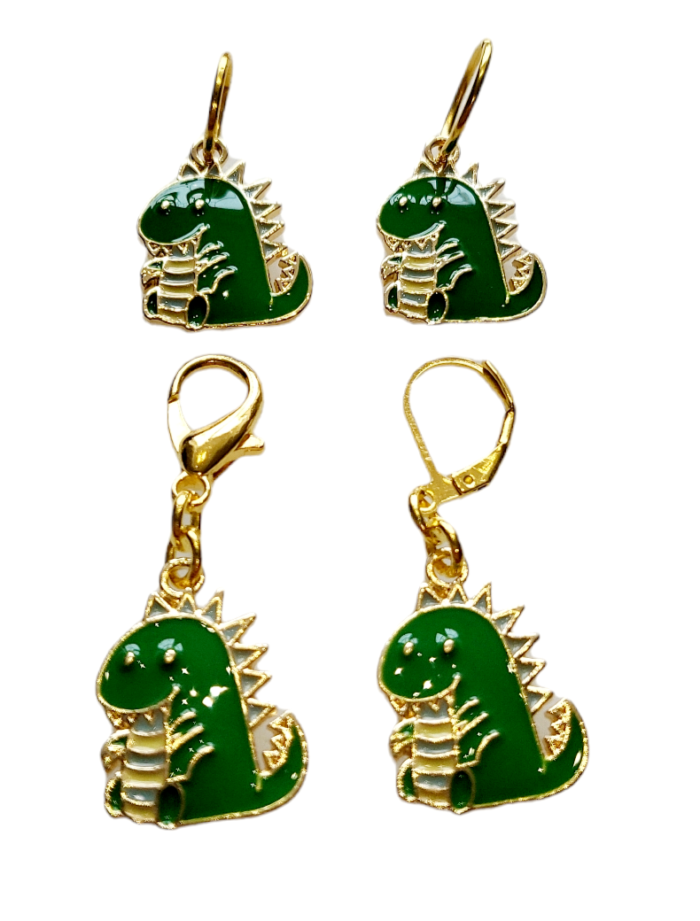 Thumbnail: 4 enamelled dinosaur charms on gold coloured metal base. 1 each on small ring, large ring, lobster clasp, lever back clasp