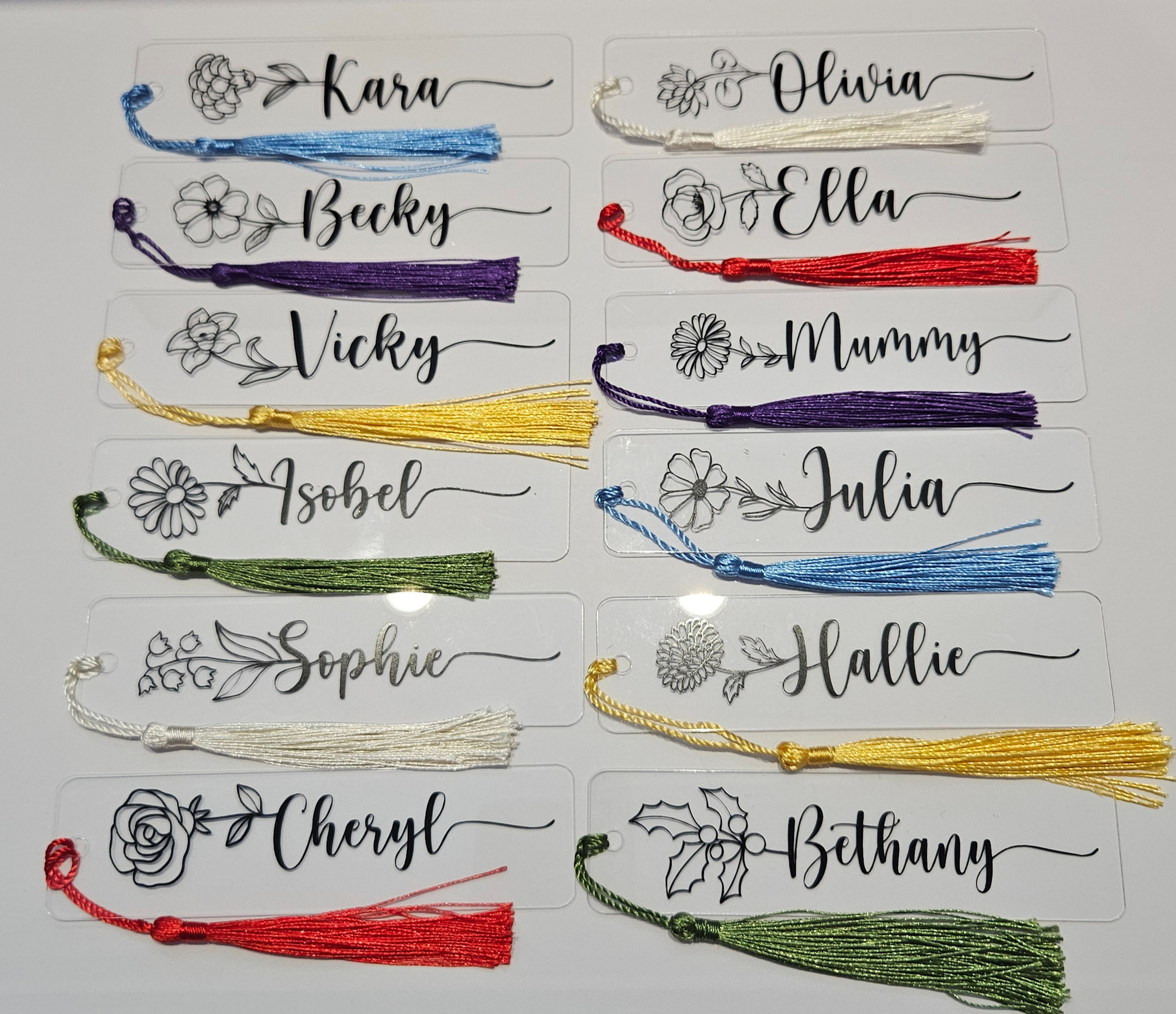 range of birth flower with name bookmarks with coloured tassels