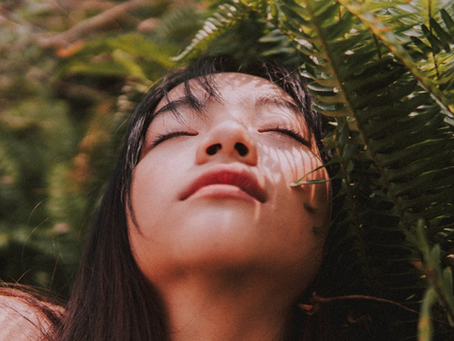 woman closed eyes in the garden