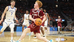 Coach Scott Campbell reunites family through Troy basketball