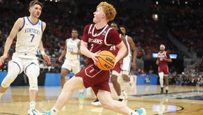 Coach Scott Campbell reunites family through Troy basketball