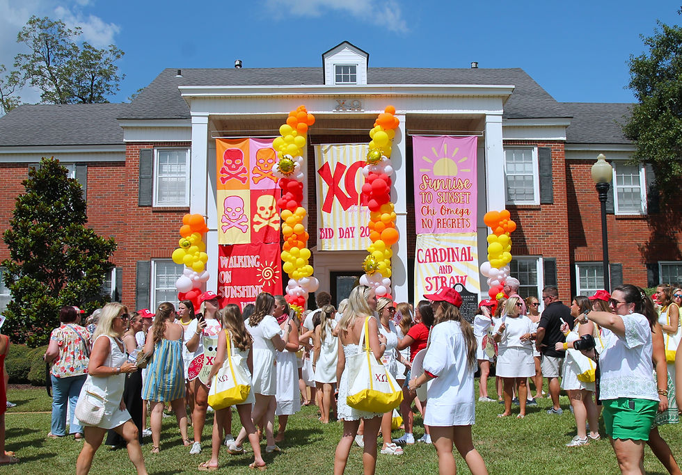 Chi Omega sisters gather in front of their house on Sorority Hill 