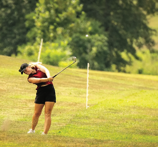 Mathilda Ringblom practices on the golf course. Troy Athletics photo