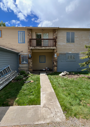 Backyard renovation setup with walk path and supplies visible.