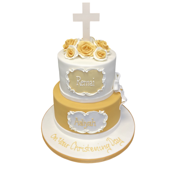 Bespoke christening cake with white icing, blue cross, and delicate floral decorations in Solihull, West Midlands.