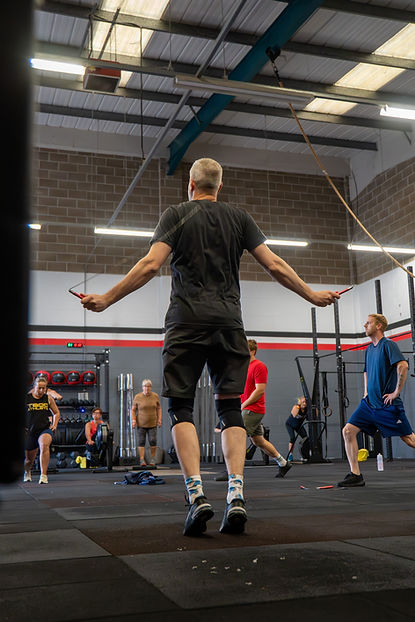 Crossfit class jumping jacks workout at T800 CrossFit