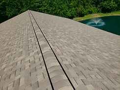 Peak Roofing LLC  roof replacement with Weathered Wood Plus shingles on a barn 