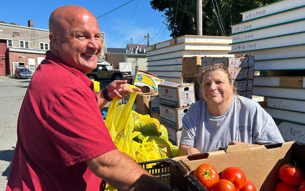 Board Members Trampas and Joline helping at HMRC's monthly food distribution