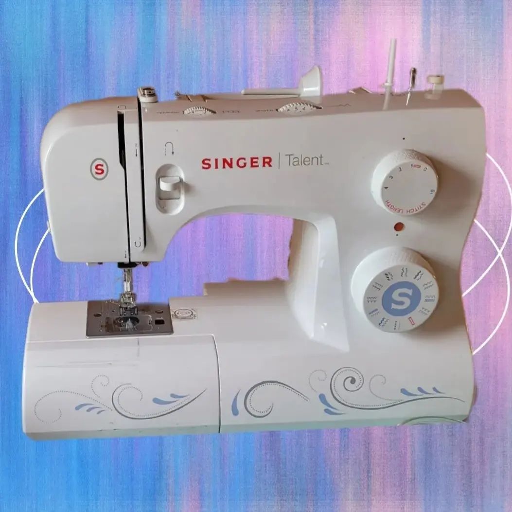 singer sewing machine with purple/pink background